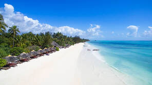 Looking down on a white sand beach next to the Melia Zanzibar