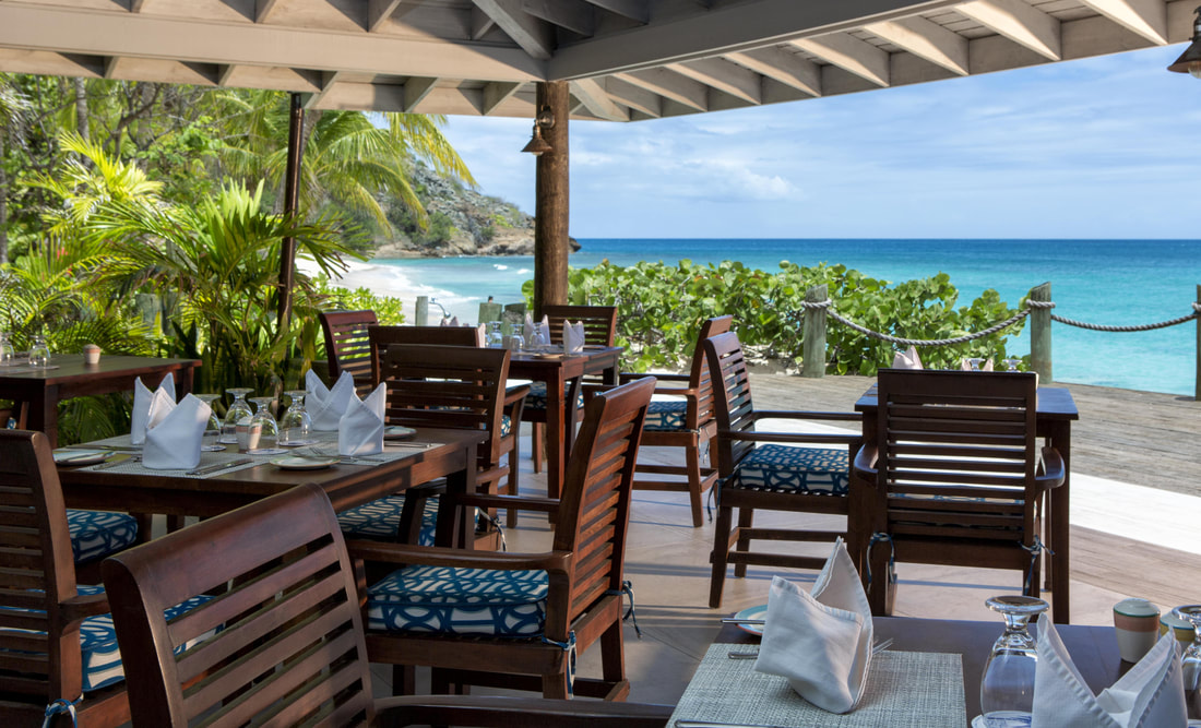 an outdoor restaurant on a beachfront