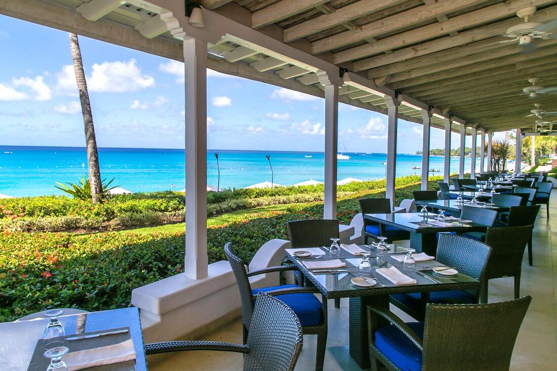 an oceanview open air restaurant at the fairmont royal pavilion