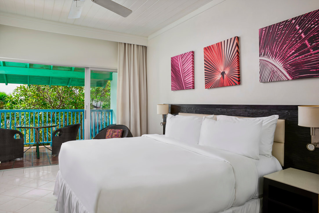 A double bedroom with balcony at Crystal Cove by Elegant Resorts