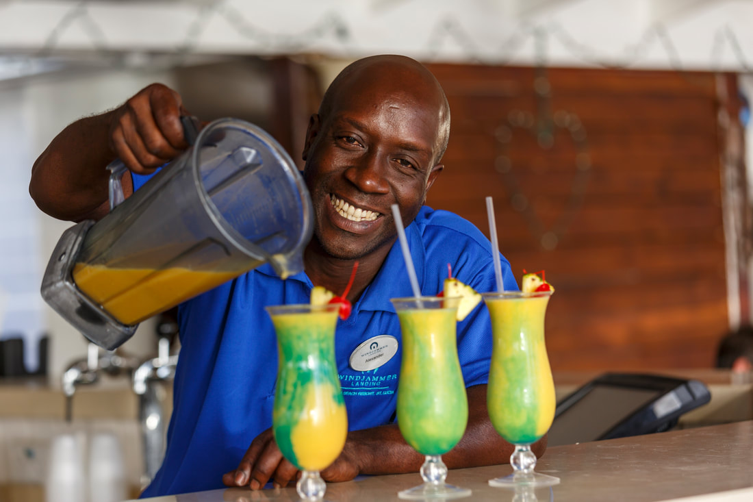 One of the staff pouring cocktails at Windjammer Landing