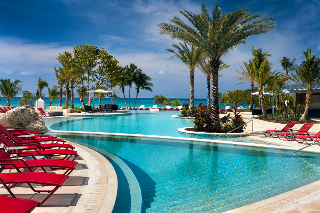 a meandering pool with sun loungers at the kimpton seafire