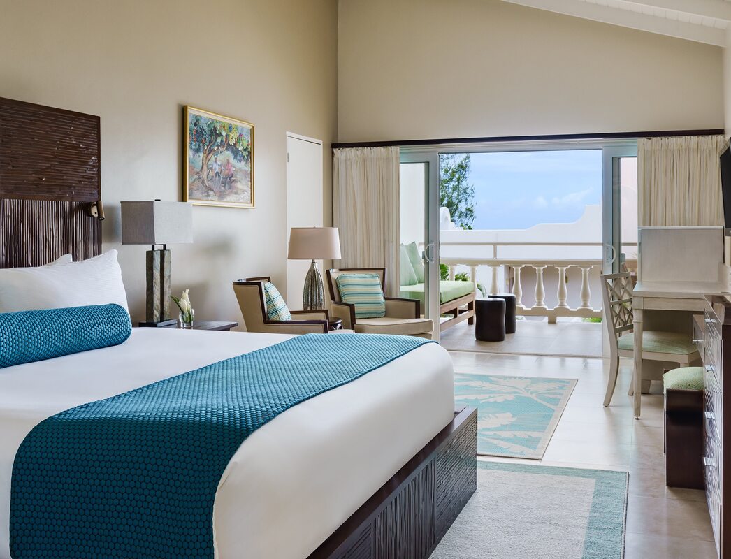 A double balcony suite with views out at the resort