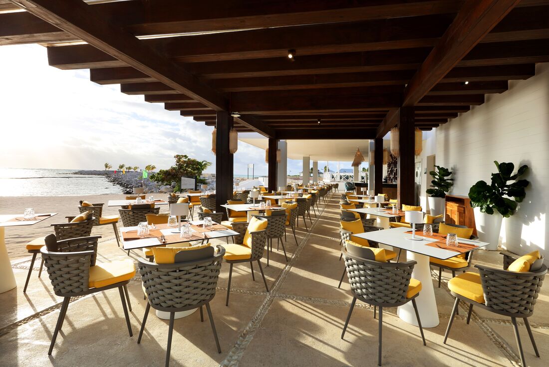 An open air beachfront restaurant at TRS Cap Cana