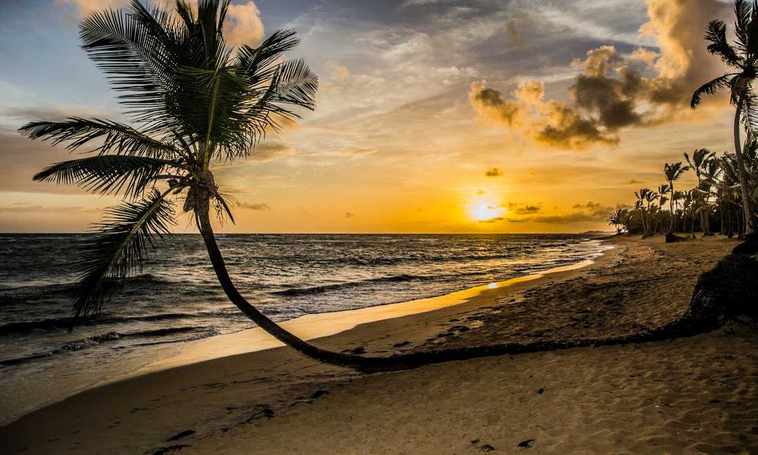 a beach at sunset in the dominican republic